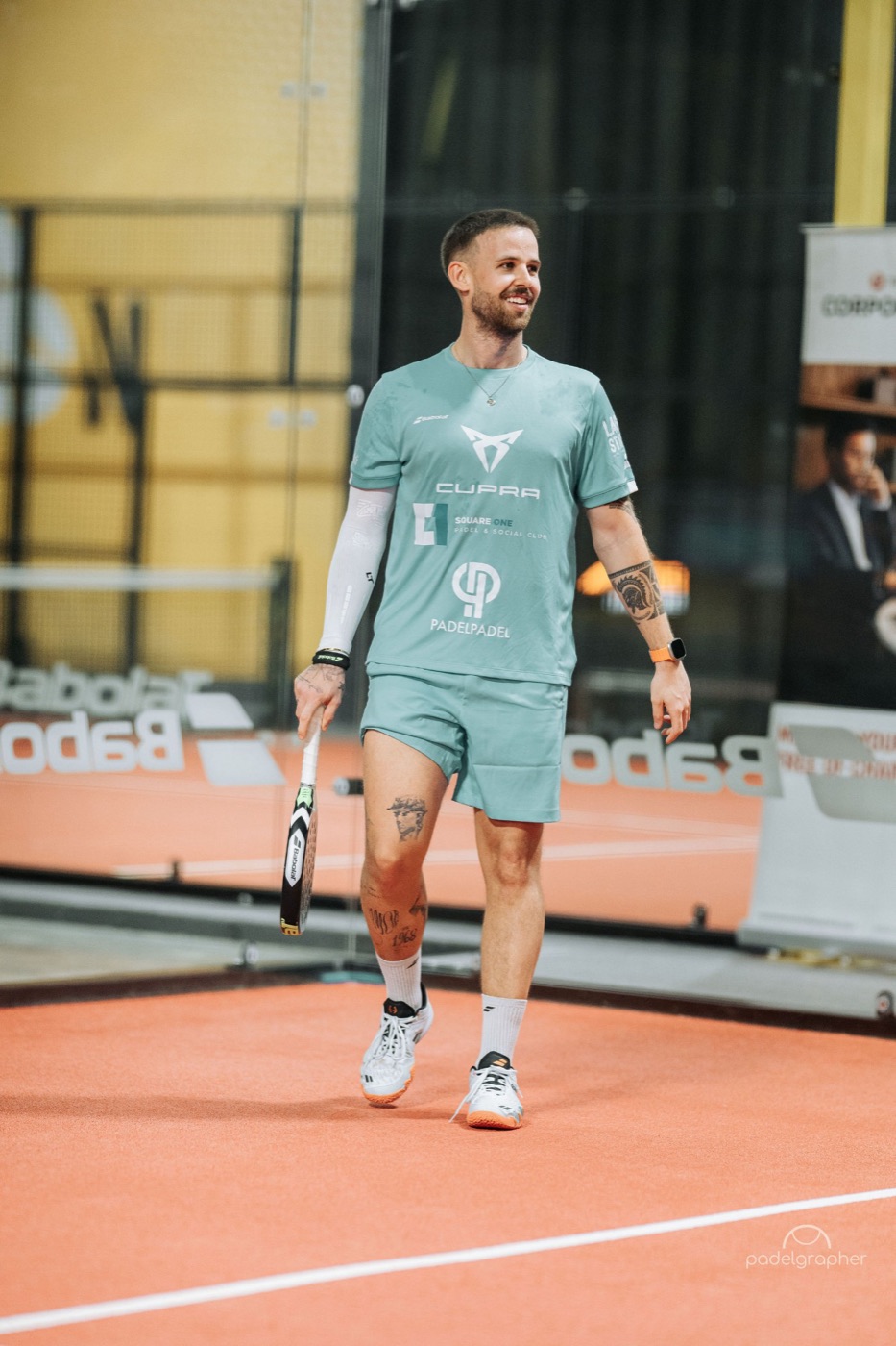 Frederik smiling on court in his sponsor kit